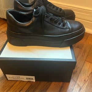 J Slides “Amanda” black/black leather platform sneakers.